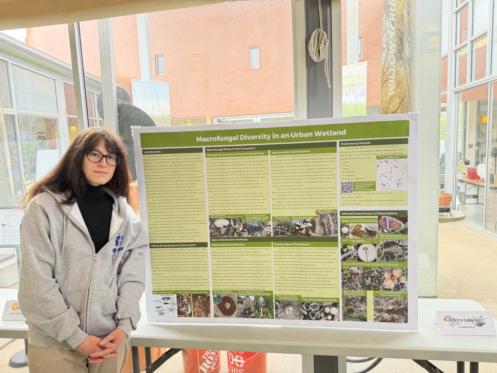 Rebecca Lampshire standing with her Expo display
