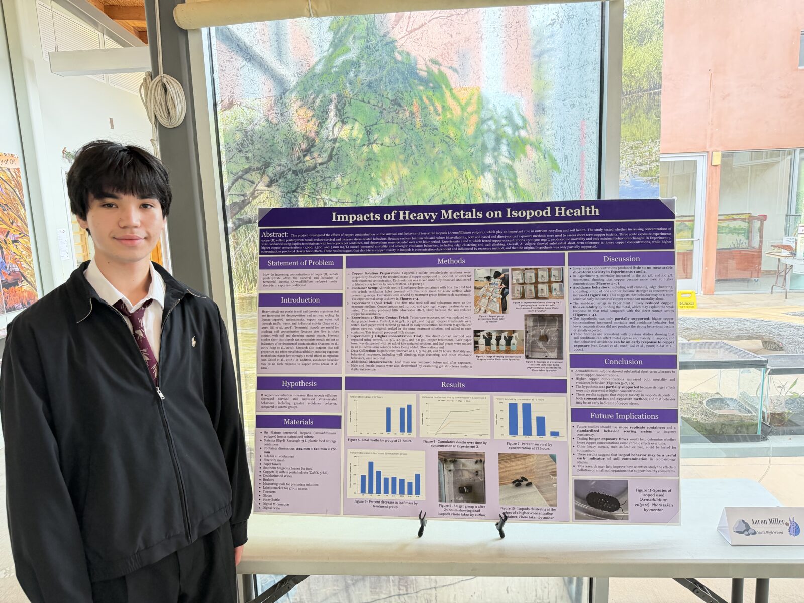 Aaron Miller standing with his Expo display